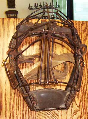 Metal and leather restored on antique catcher mask